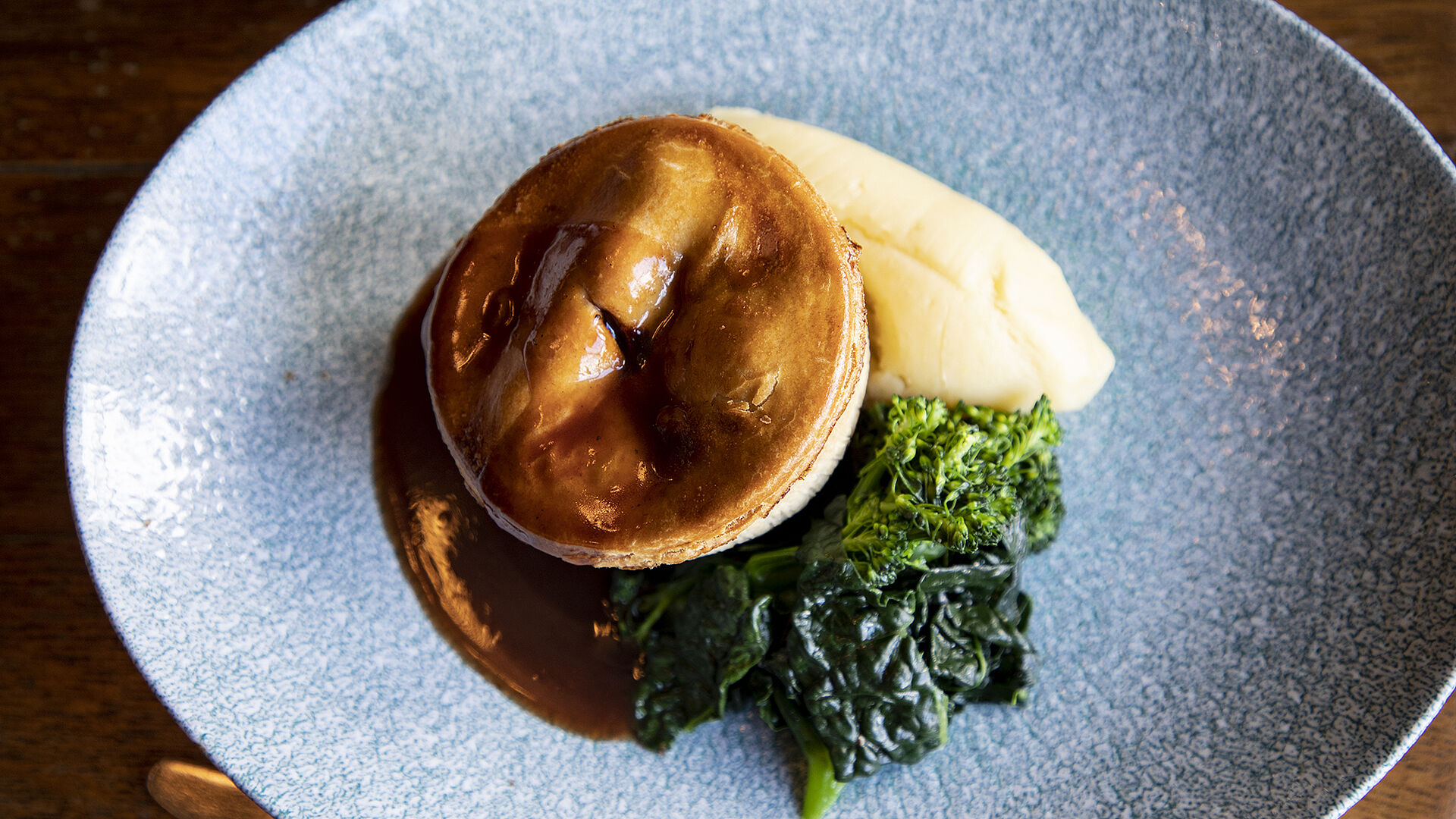 Pie and vegetables with a pint of 6X